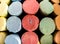 Close up background photograph image of colorful sidewalk chalk including red, green, blue, yellow and orange organized in rows by