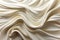 A close up background of a white fabric on waves