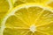 Close up background of yellow fresh lemon slice