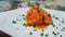 Close-up on baked cauliflower with sauce on a plate