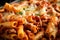 Close-up of Baked Ziti with Spicy Italian Sausage and Tomato Sauce