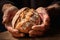 Close-up of a bakers weathered hands cradling a freshly baked loaf, symbolizing the art of traditional bread-making