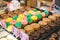 Close up of bakery display case with cookies and cupcakes