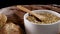 Close up of bakery products and grain in bowl with wooden spoon