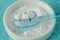 Close-up of baking soda in a bowl with a toothbrush - Teeth whitening