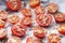 Close-up of baking tray with seasoned tomatoes