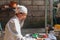 Close up of a Balinese pedanda during prayer. side view of a hindu priest performing a ceremony. A hindu priest performing