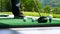 Close up ball on tee retired golfer taking swing hitting golf ball off tee on golf course