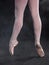 The close-up of ballerina in pointe shoes
