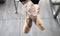 Close up of ballerina`s leg, she is standing on stair outside wearing