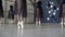 Close-up of ballerinas dancing in black dresses and white pointe shoe. Action. Ballerinas prepare for ballet and dance