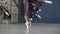 Close-up of ballerinas dancing in black dresses and white pointe shoe. Action. Ballerinas prepare for ballet and dance