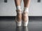 Close up of a ballet dancer`s bare feet in pointe shoes