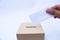 Close up of a ballot box and casting vote