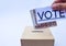 Close up of a ballot box and casting vote