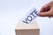 Close up of a ballot box and casting vote