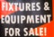 Close up of bankruptcy fixture and equipment for sale sign.