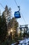 Close up Bansko cable car cabin, pine trees and