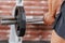 Close up of barbell lifting by man