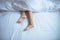 Close up of barefoot,Feet and stretch lazily on the bed