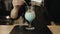 Close-up of barista hands making a milk beverage