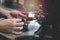 Close up of barista hands preparing hot coffee, waiter staff working with coffee machine in coffee shop counter bar