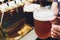 Close-up of barman hand at beer tap pouring a draught lager beer.