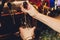 Close-up of barman hand at beer tap pouring a draught lager beer.