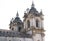 Close up of the baroque towers of Alcobaca Monastery, during bright day. Roman Catholic monastic complex in Portugal.