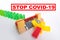 Close-up barrier stop dominoes continuous toppled or risk with copy space, concept to stop vaccination of the population from