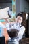 Close-up of bartender filling up machine with coffee beans