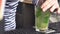 Close up of bartender making mojito cocktail at the bar