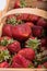 Close-up of a basket full of ripe strawberries.