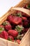 Close-up of a basket full of ripe strawberries.