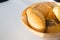 Close up of basket of various fresh bread rolls and buns on whit