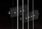 Close-up bass guitar pickups and strings. Musical instruments. Black guitar deck