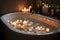 close-up of bathtub filled with warm water and bubbles, surrounded by candles for a peaceful and soothing atmosphere