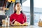 Close up of beaming appealing woman eating breakfast in cafe