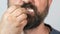 Close-up, bearded man eats fast food, french fries with mayonnaise