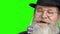 Close up bearded man with microphone on green screen.