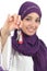 Close up of a beautiful arab woman holding a home keys