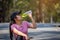 Close-up of beautiful asian woman sport athletes drinking water with electrolytes after exercise. Asian woman dehydrated sweating