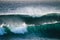 Close up of beautiful and bigs blue and green waves breaking - pacific or athlantic ocean - blue sea and great place to surf