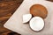 A close-up of beautiful coconuts on a brown background. Freshly sliced coconut on a burlap sack. Tasty vegetarian ingredients.