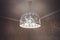 Close-up of a beautiful crystal chandelier Beautiful chandelier. luxury expensive chandelier hanging under ceiling.