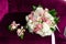 Close up of beautiful elegant wedding bouquet with white,pink roses,green fresh leaves and two boutonnieres in the
