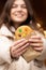 Close-up, a beautiful gingerbread in the hands of a woman.