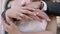 Close-up of beautiful hands of newlyweds. Action. Hands of hugging newlyweds. Beautiful hands in tender embrace of