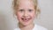 Close-up beautiful little girl 6-7 years old has lost milk teeth. Loss of milk teeth, replacement of permanent teeth