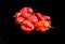 Close up of beautiful Nigerian pepper callled Atarodo isolated on Black Background. Red SCOTCH BONNET PEPPERS on black background